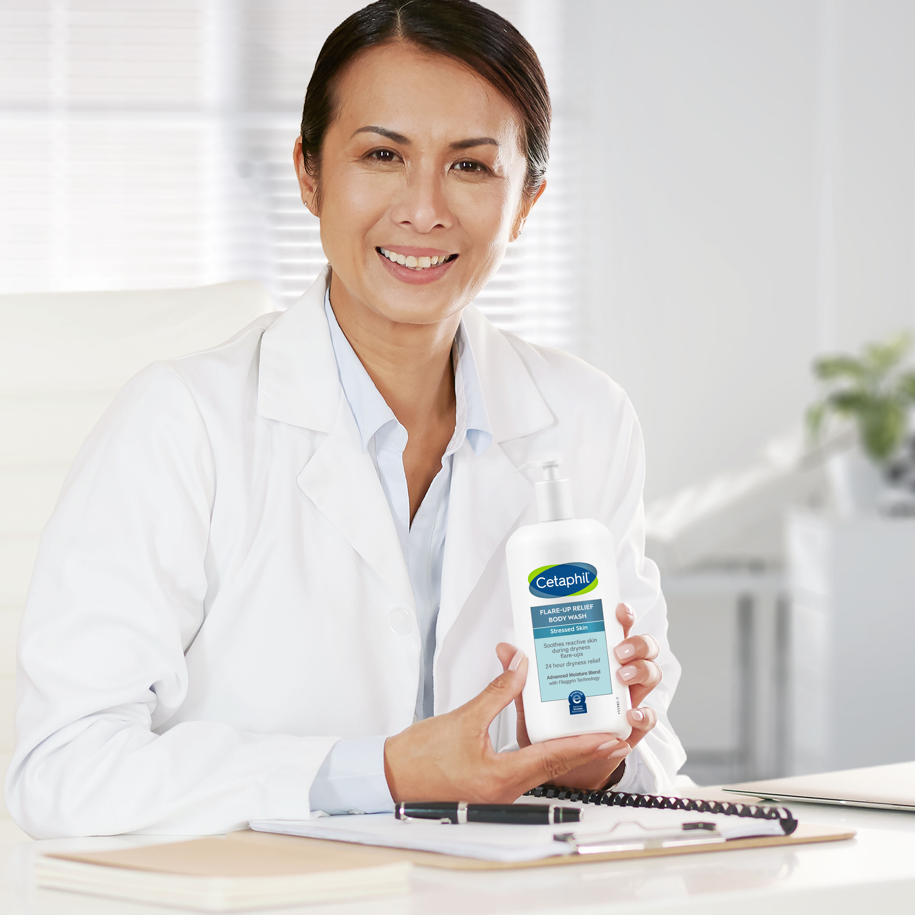 cetaphil flare up relief body wash doctor holding bottle